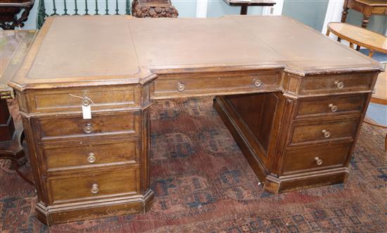 An early 20th century oak pedestal partners desk W.186cm